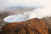 Experience Volcanoes National Park: Helicopter, Coach, and Walking Tour from Kona