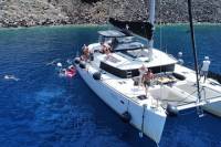 Half-Day Exclusive Catamaran Cruise in Santorini with Meal and Open Bar
